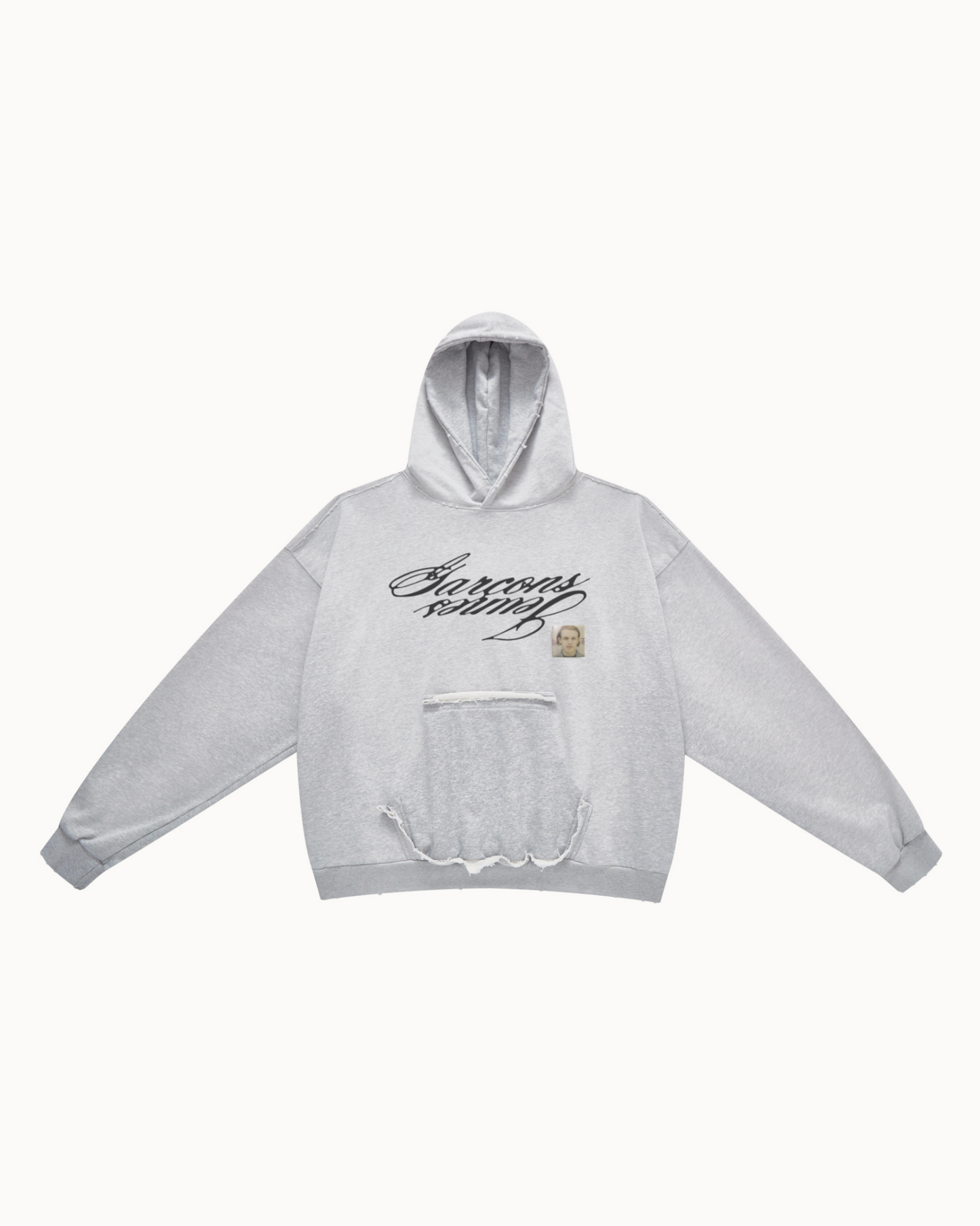 Heather grey reversible hoodie, front view with the mirrored Garçons Jeunes script and the photo patch