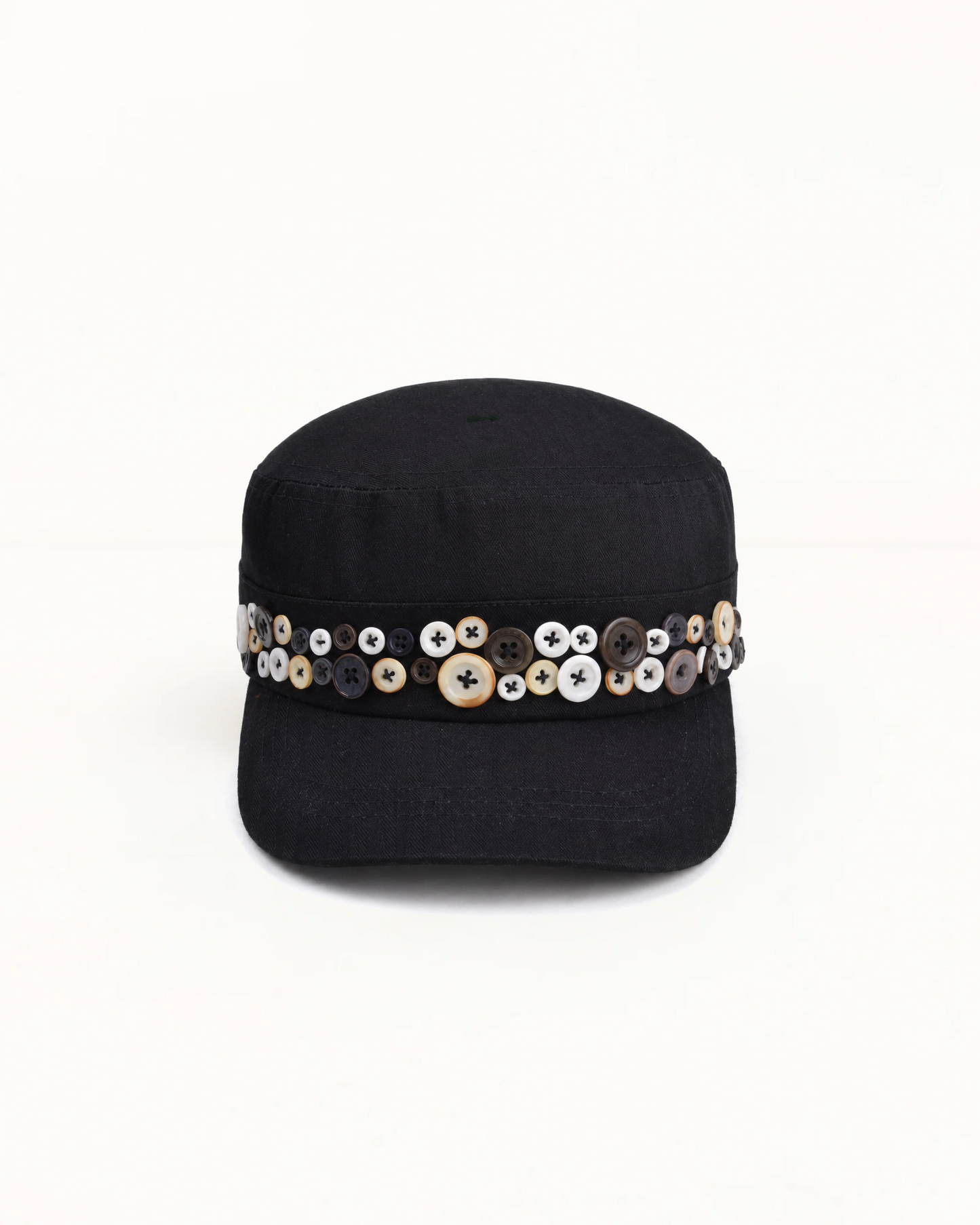 Black herringbone twill cadet cap, band set with mismatched pearl and horn buttons