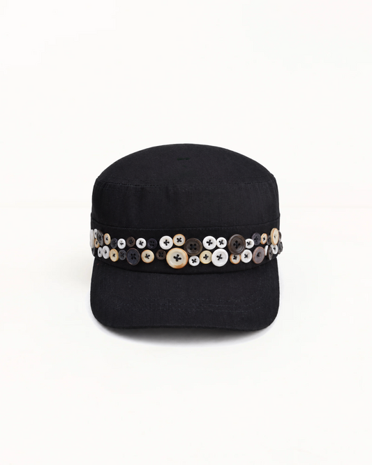 Black herringbone twill cadet cap, band set with mismatched pearl and horn buttons